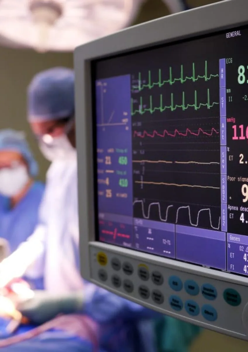 Patient monitor displaying vital signs during heart surgery