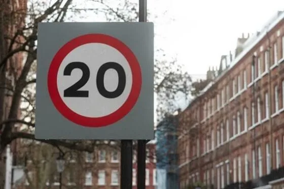 20mph speed limit sign on residential street