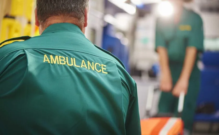 Ambulance worker in hospital emergency department