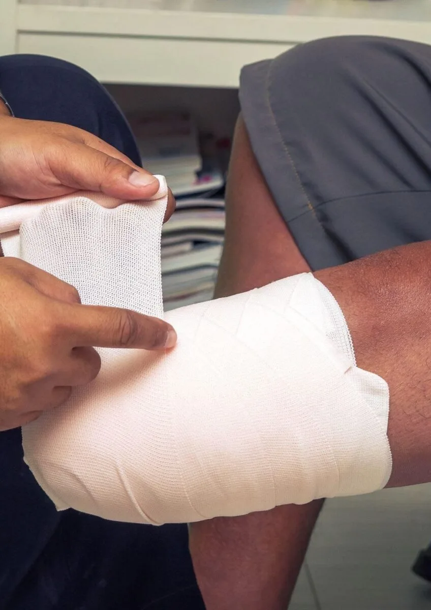 Bandage being wrapped around leg injury