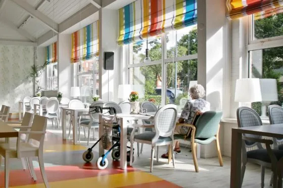 Care home dining room with mobility aid