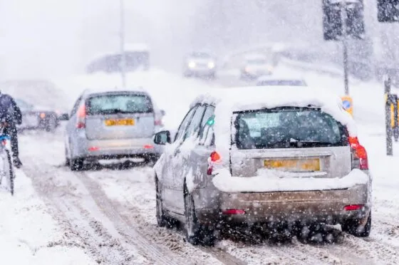 Cars driving through heavy snow