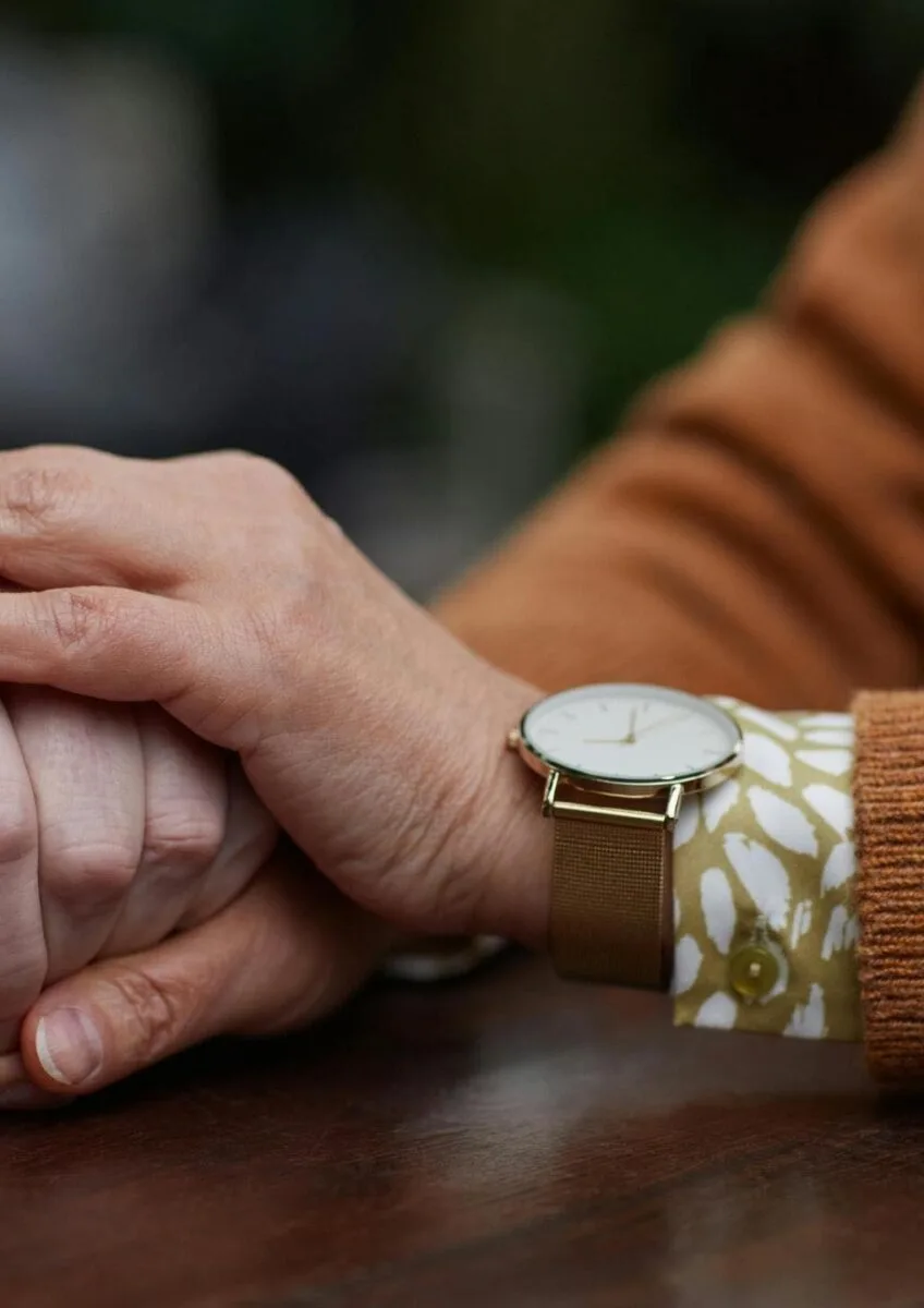 Close-up of one person comforting another