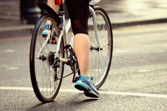 Cyclist waiting at road junction