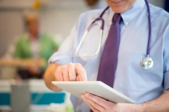 Doctor using tablet in hospital