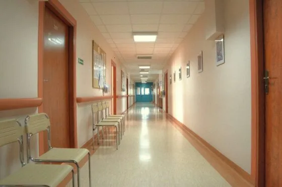 Empty hospital corridor with chairs
