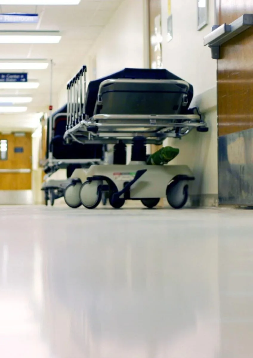 Empty hospital corridor with trolley