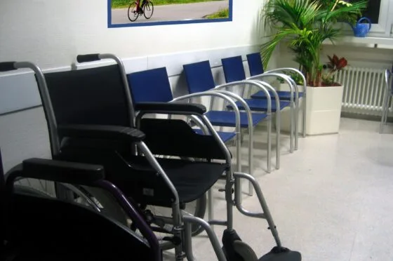 Empty hospital waiting area with wheelchairs