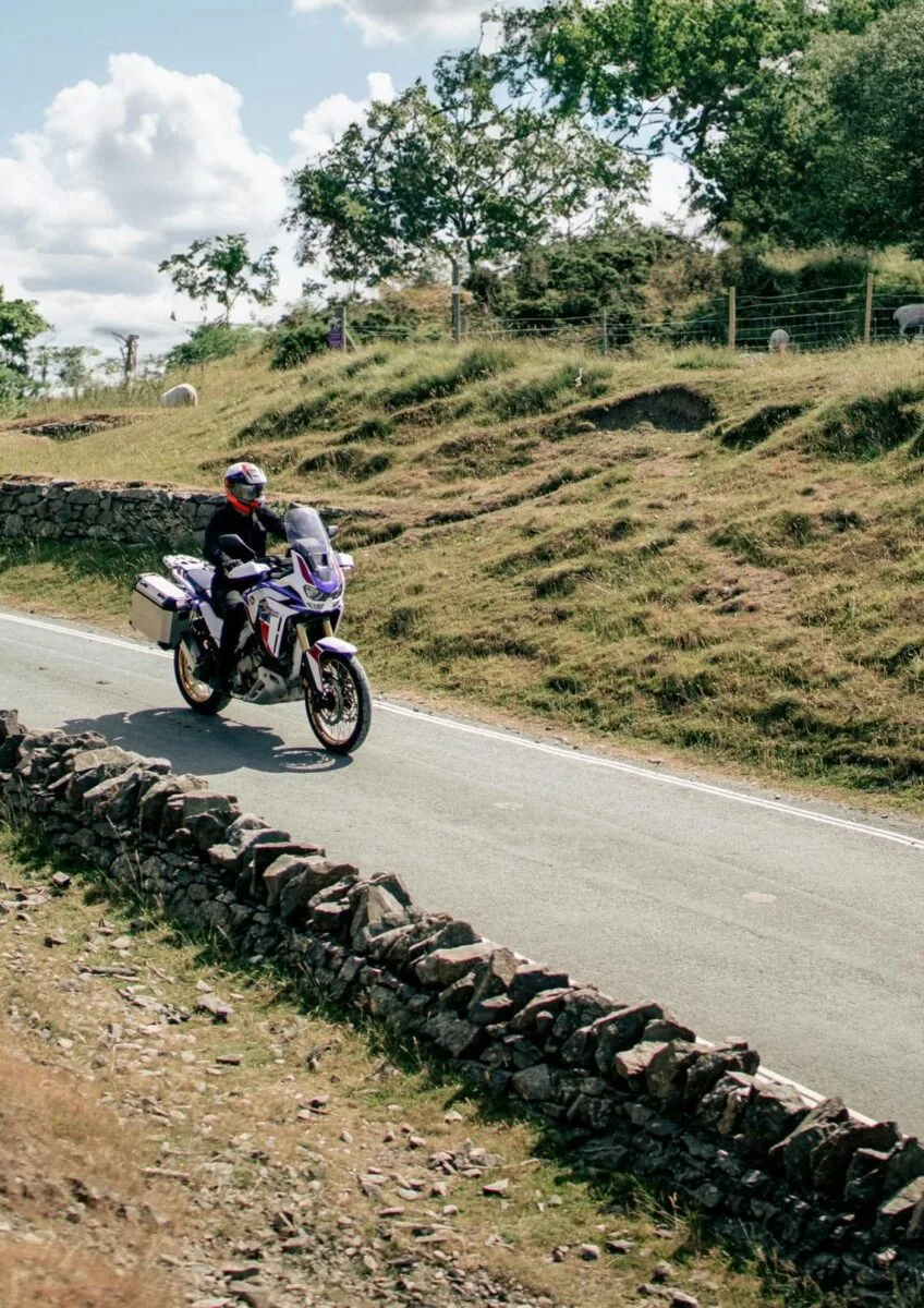 Group of motorcyclists riding through countryside