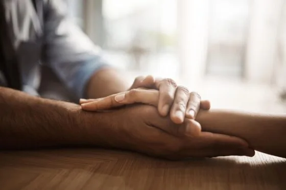 Hand holding reassurance