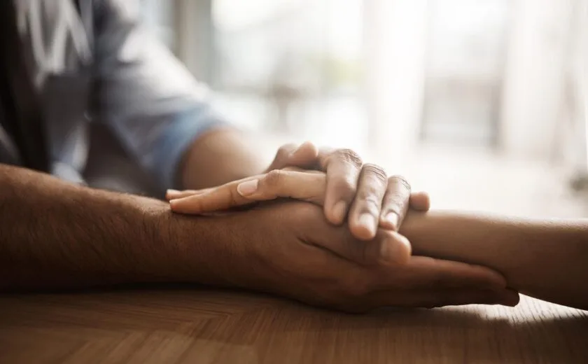 Hand holding reassurance