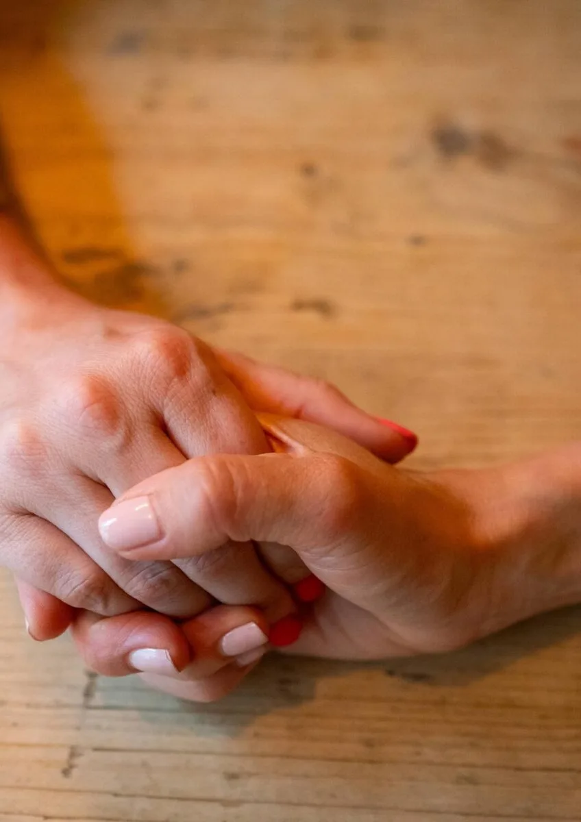 Holding hands being reassured