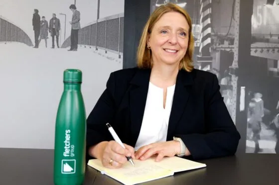 Jill Heywood writing at desk
