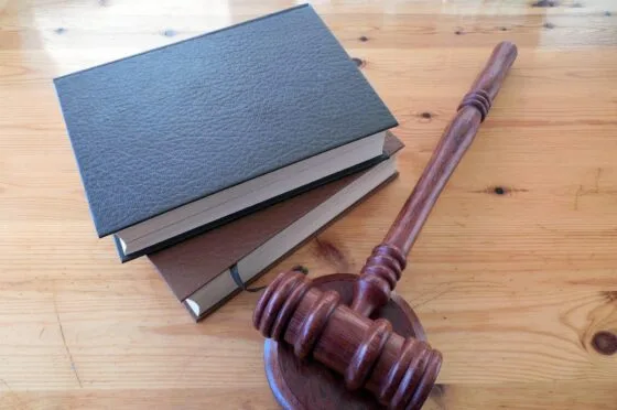 Judge's gavel beside legal books