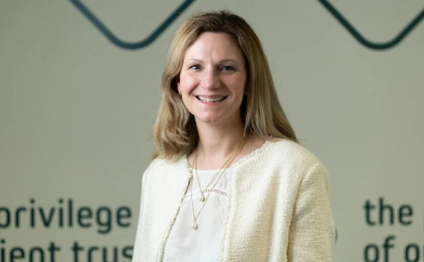 Kate Edwards smiling in front of Fletchers backdrop