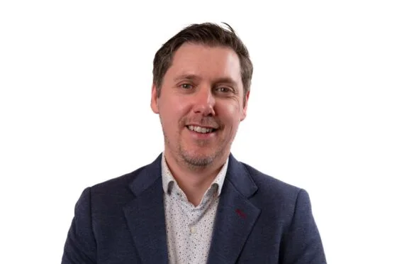 Michael Gray smiling in professional headshot