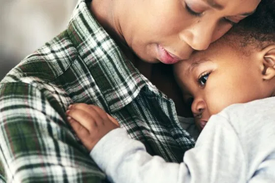 Mother hugging child