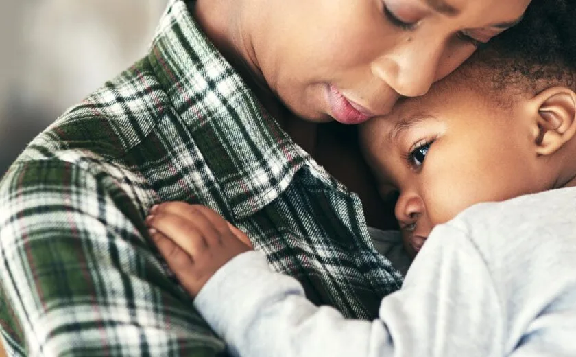 Mother hugging child