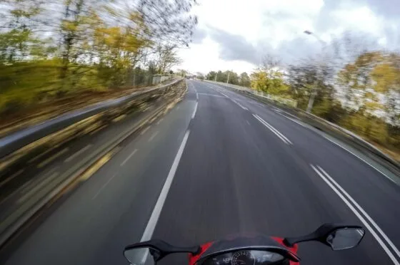 Motorcyclist riding along open road
