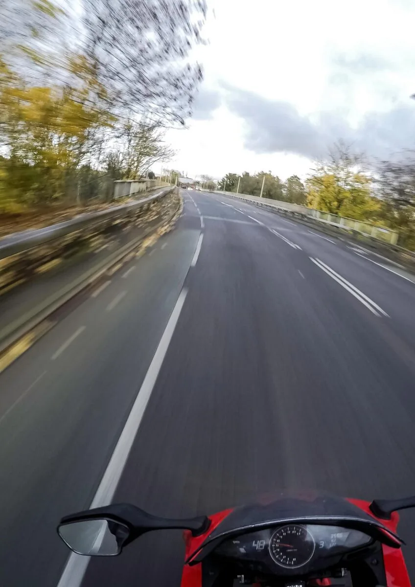 Motorcyclist riding along open road