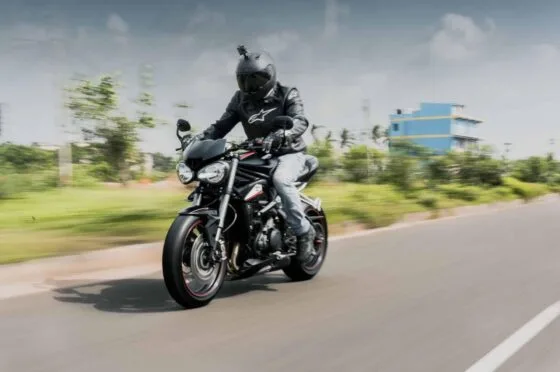 Motorcyclist riding on open road