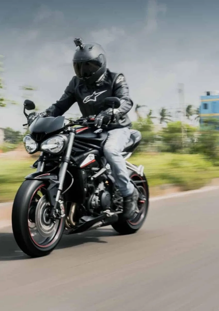 Motorcyclist riding on open road
