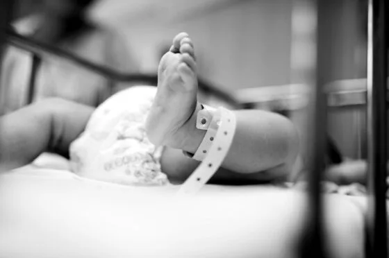 Newborn baby wearing hospital wristband