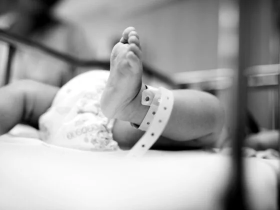 Newborn baby wearing hospital wristband