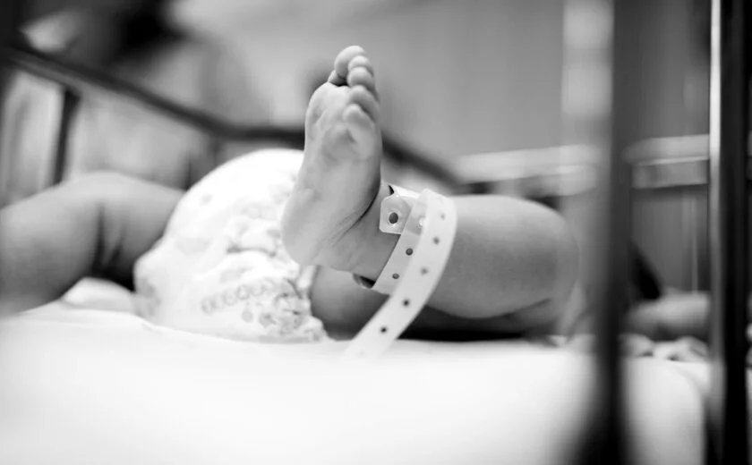 Newborn baby wearing hospital wristband