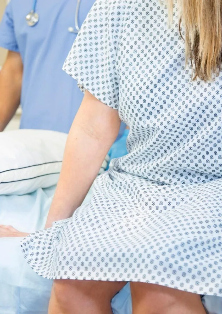 Patient sitting on hospital bed