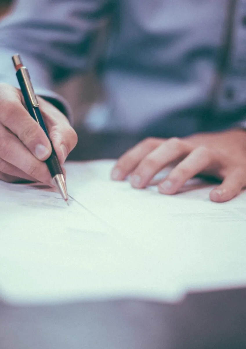 Person signing legal paperwork