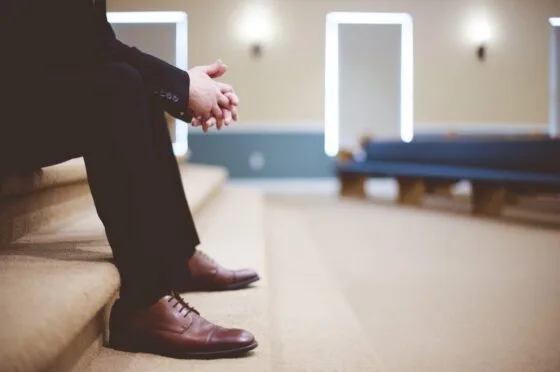 Person sitting alone in hospital waiting area
