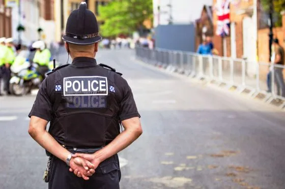 Police officer standing on city street