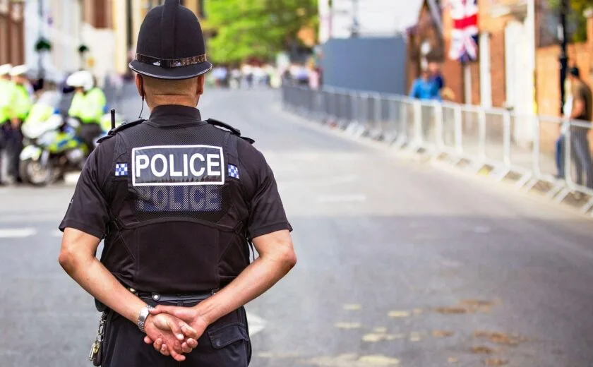 Police officer standing on city street