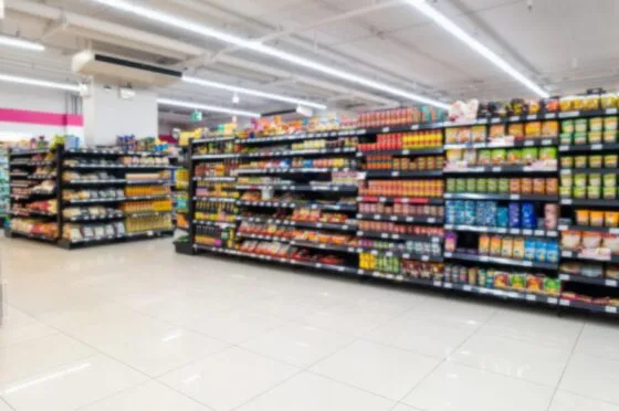 Supermarket aisle with stocked shelves