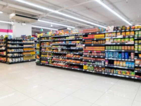 Supermarket aisle with stocked shelves