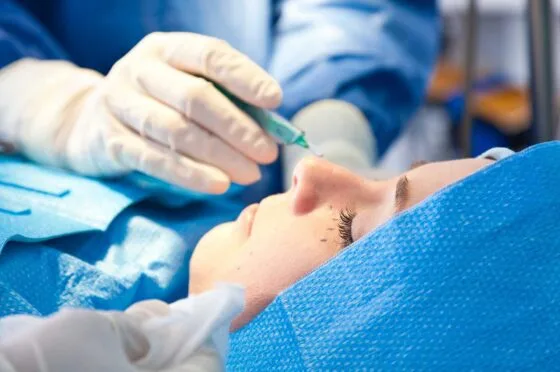 Surgeon operating on patient's eye