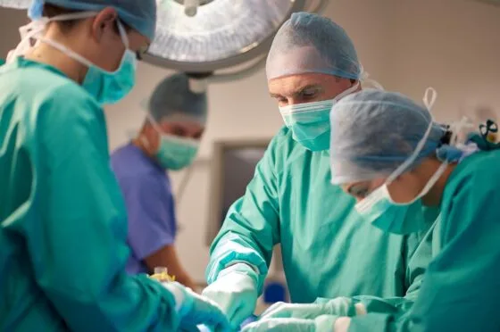 Surgical team operating in theatre