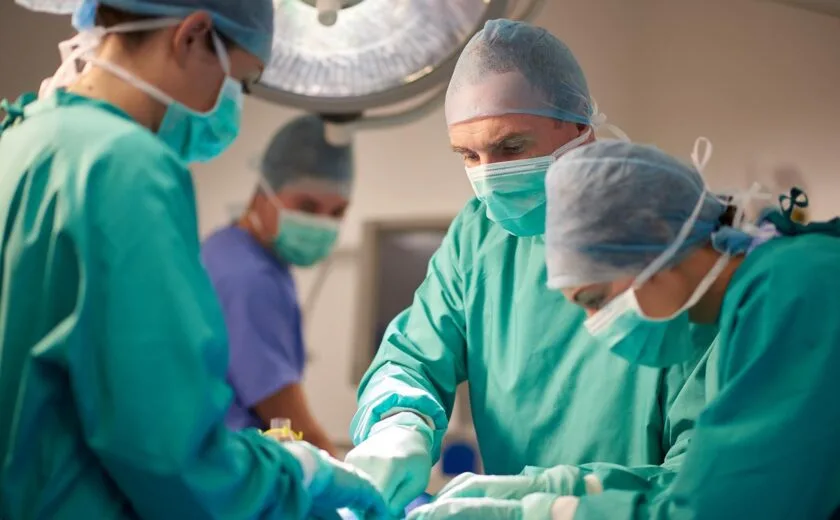 Surgical team operating in theatre