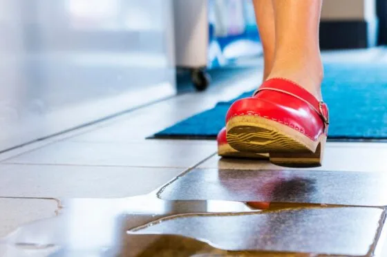 Wet floor slip hazard near walking foot