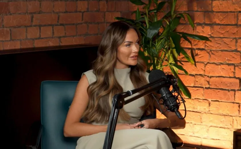 Woman speaking into podcast microphone