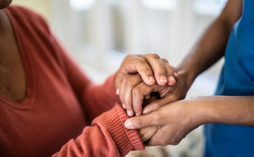 Women holding rassurance hands