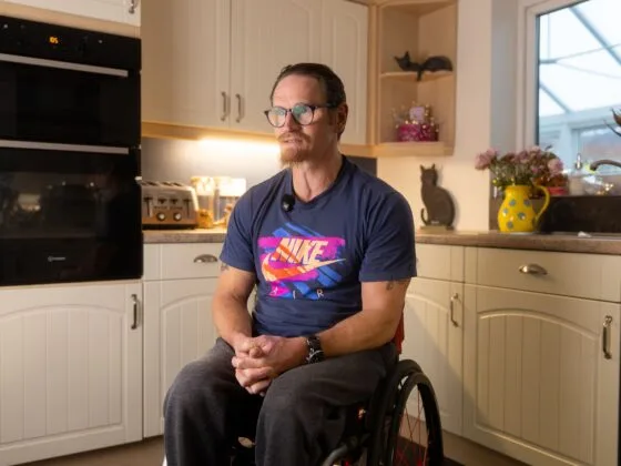 Our Client Ian in a wheelchair