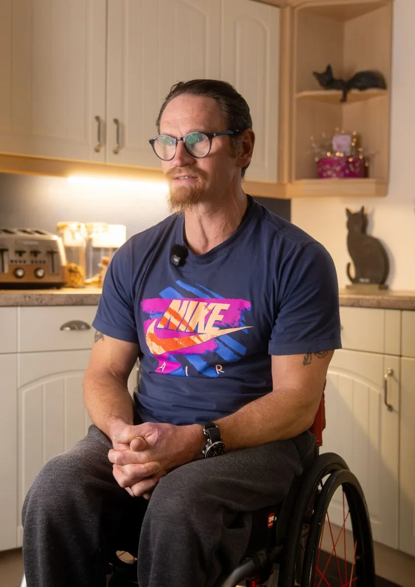 Our Client Ian in a wheelchair