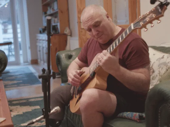 Tony playing guitar