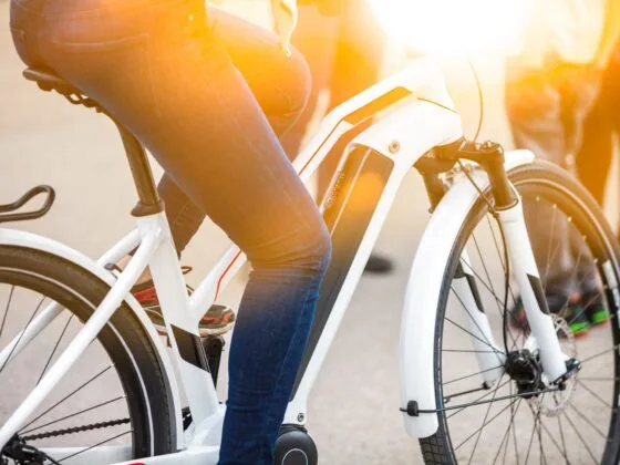 Close-up of battery pack on modern white electric bicycle