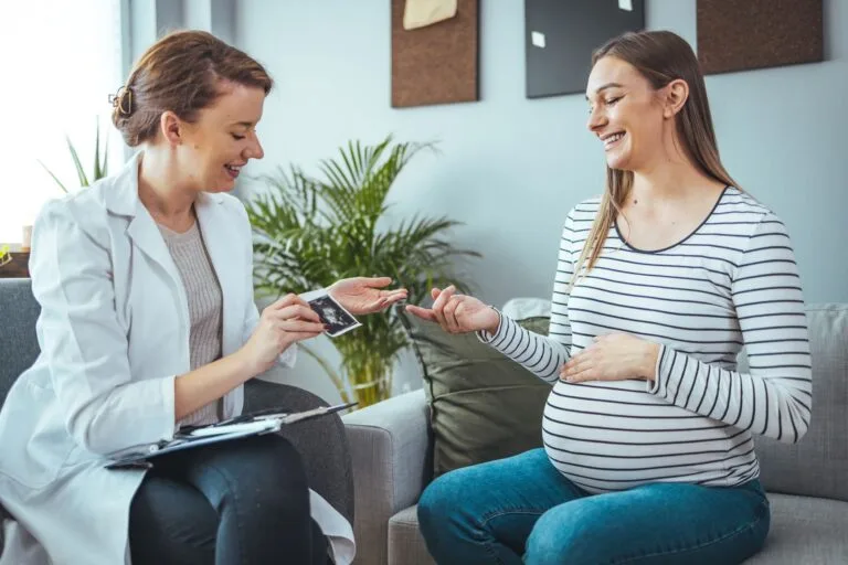 mother and doctor with scan image
