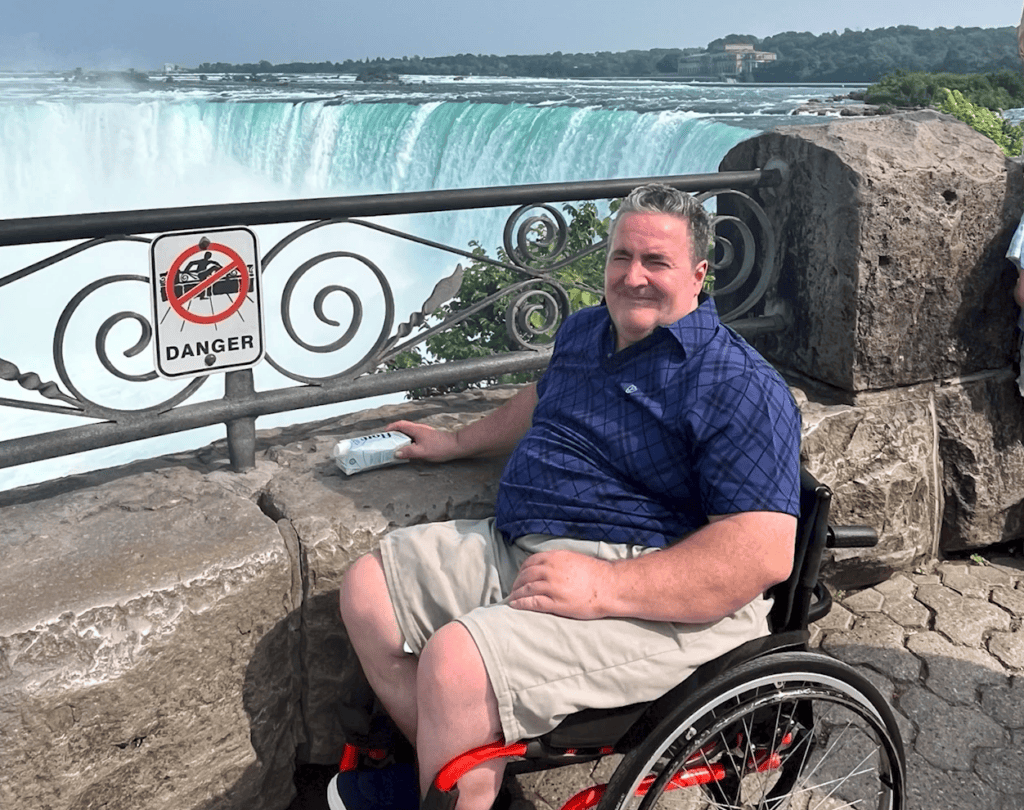 Arfon sat in a wheelchair at niagra falls