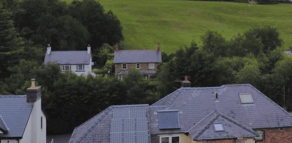 A picture of houses surrounded by countryside
