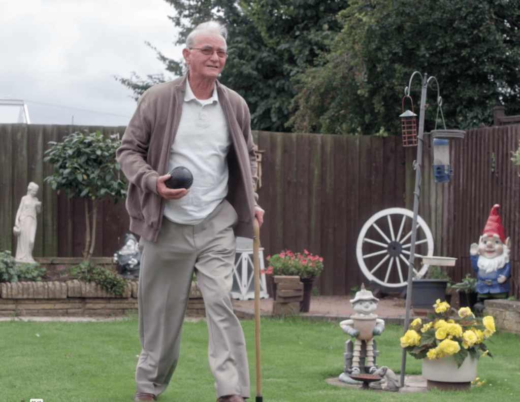 Gordon walking in his garden